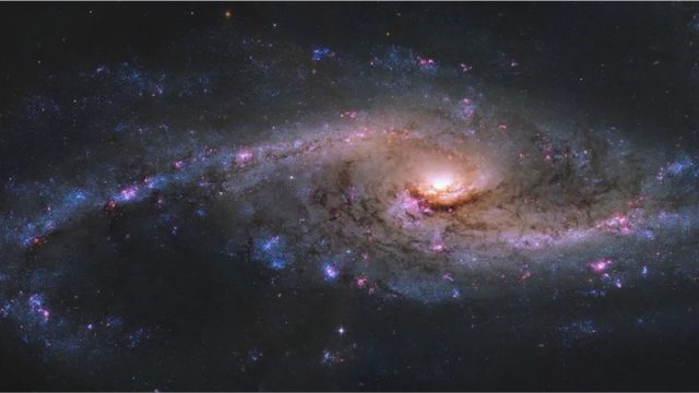Hubble Telescope Captures NGC 4536, a Starburst Galaxy with Intense Star Formation